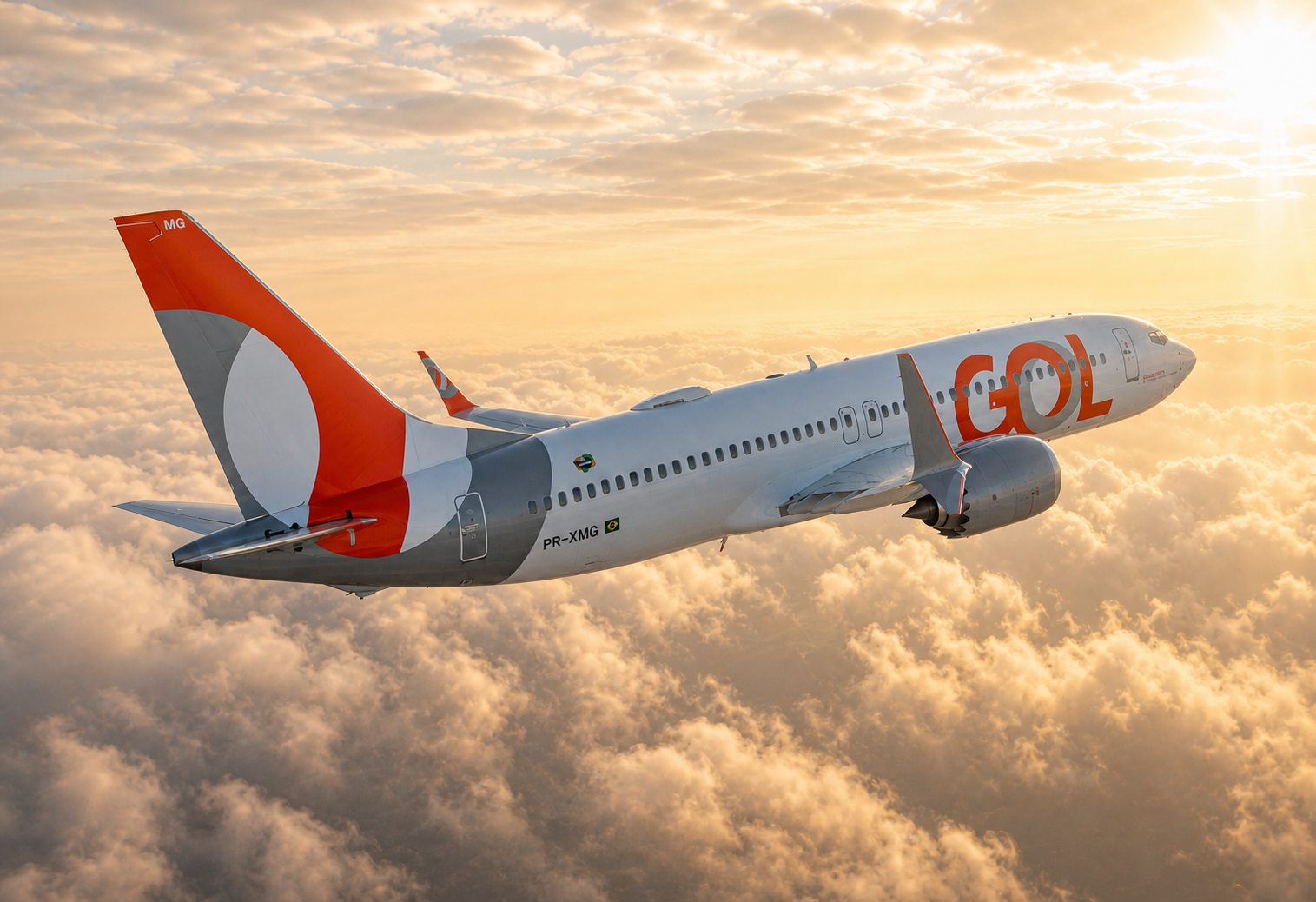 GOL Airlines aircraft above the clouds at sunrise, a corporate aviation image representing trust and innovation.